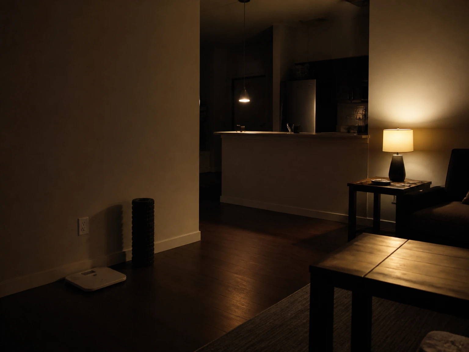 Small wall object resting near a household scale beside a clean smooth painted wall