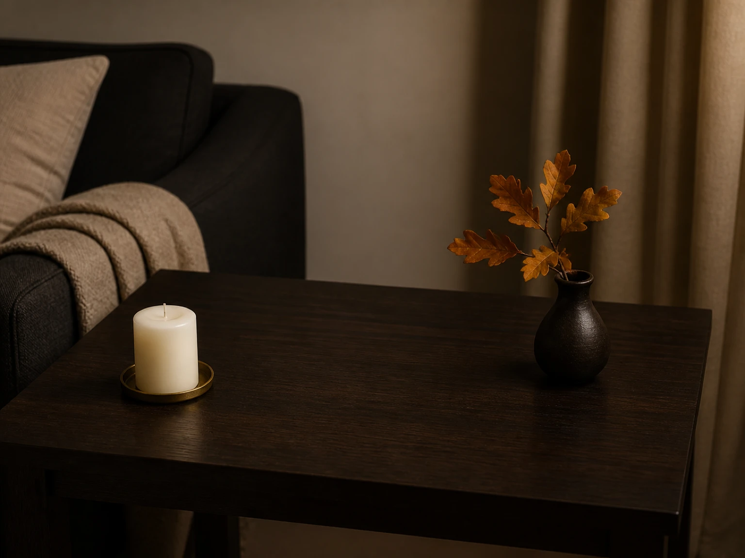 Edited dark side table with open space around a candle and autumn branch